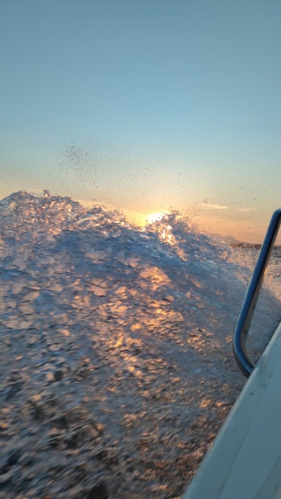 boat wave sunrise